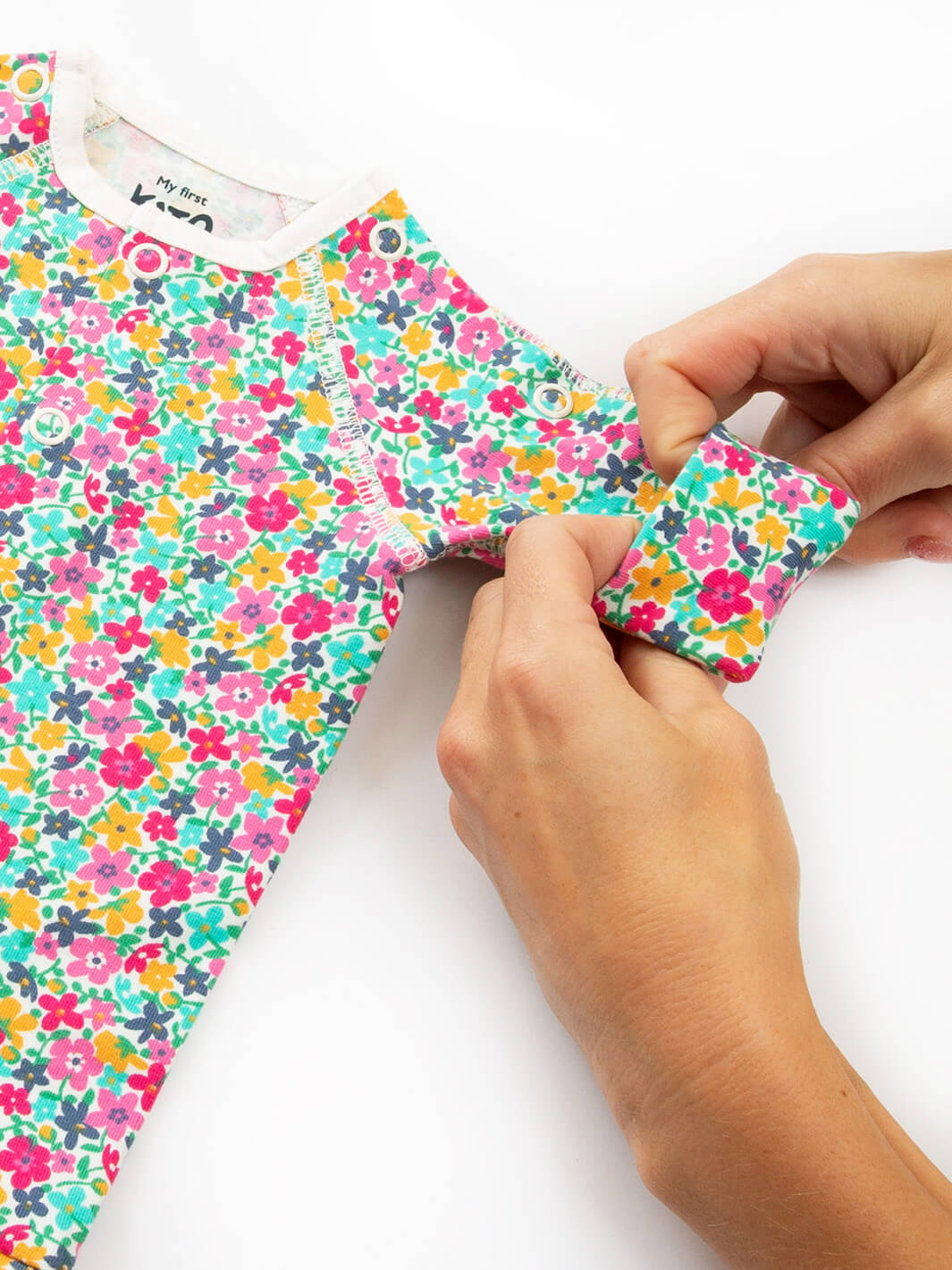 Close-up sleeve cuff detail on preemie organic cotton sleepsuit Petal Potion