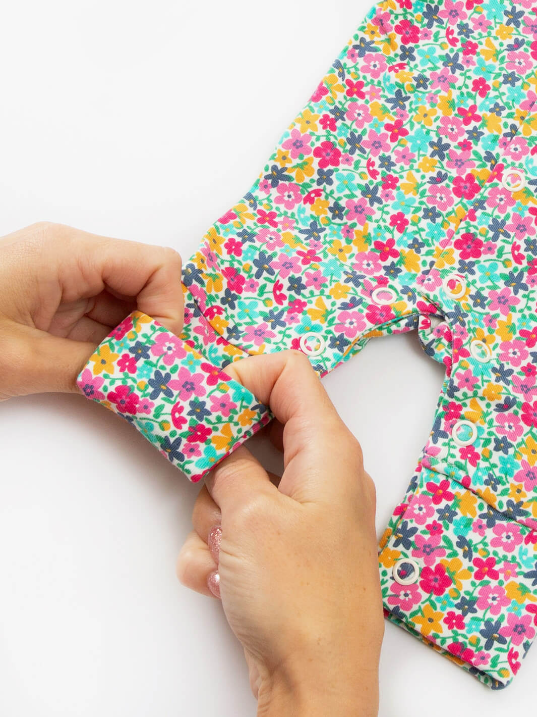 Close-up ankle cuff detail on preemie organic cotton sleepsuit Petal Potion