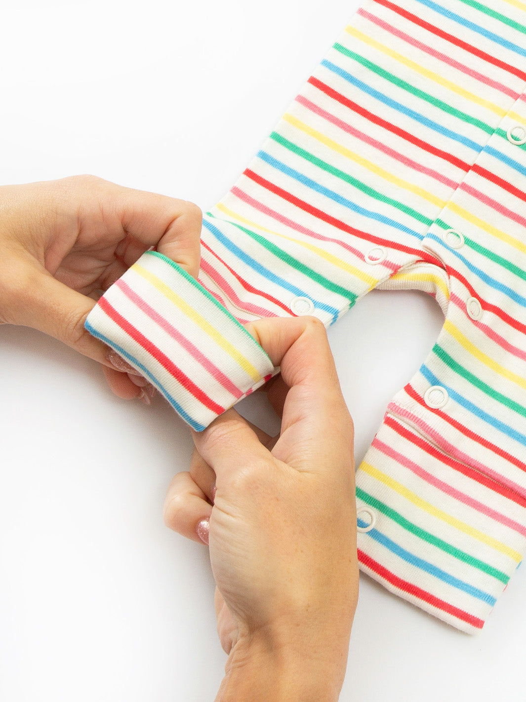 Close-up ankle cuff detail on preemie organic cotton sleepsuit Rainbow Stripe