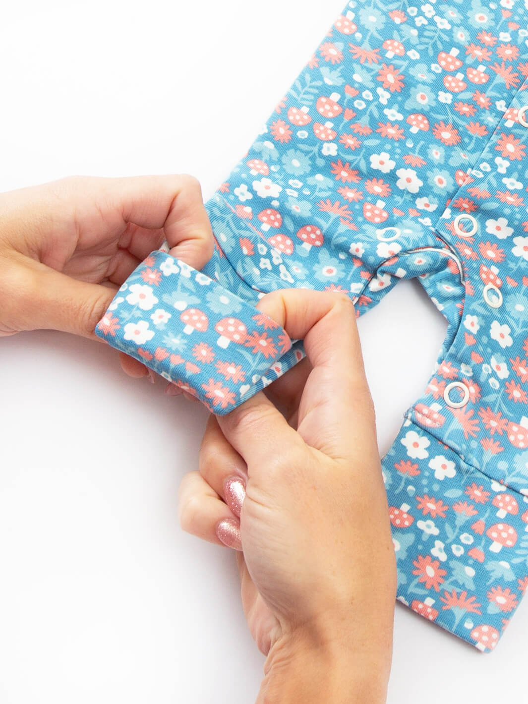 Close-up ankle cuff detail on preemie organic cotton sleepsuit Winter Woodland